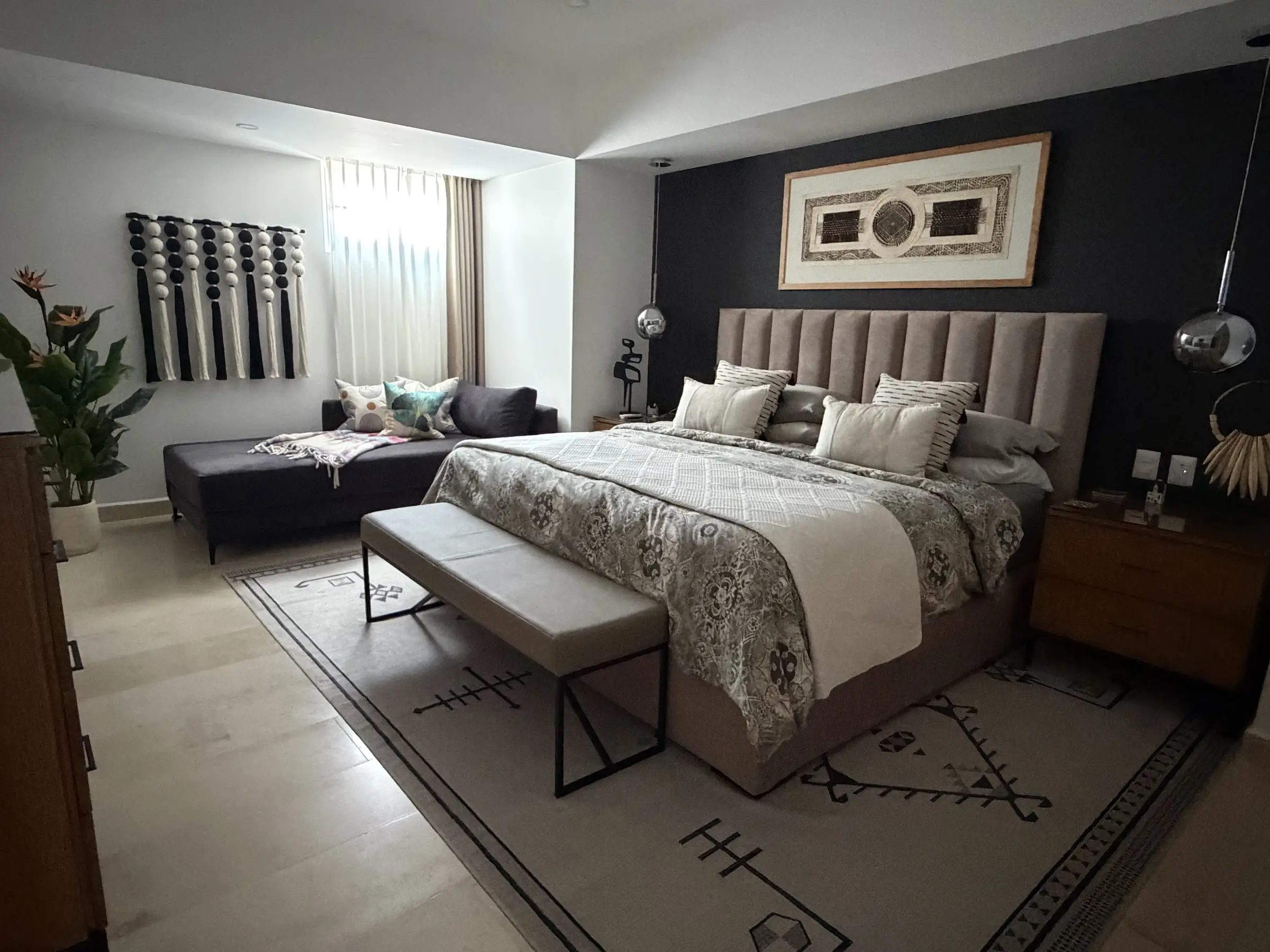 Spacious king bedroom in daylight