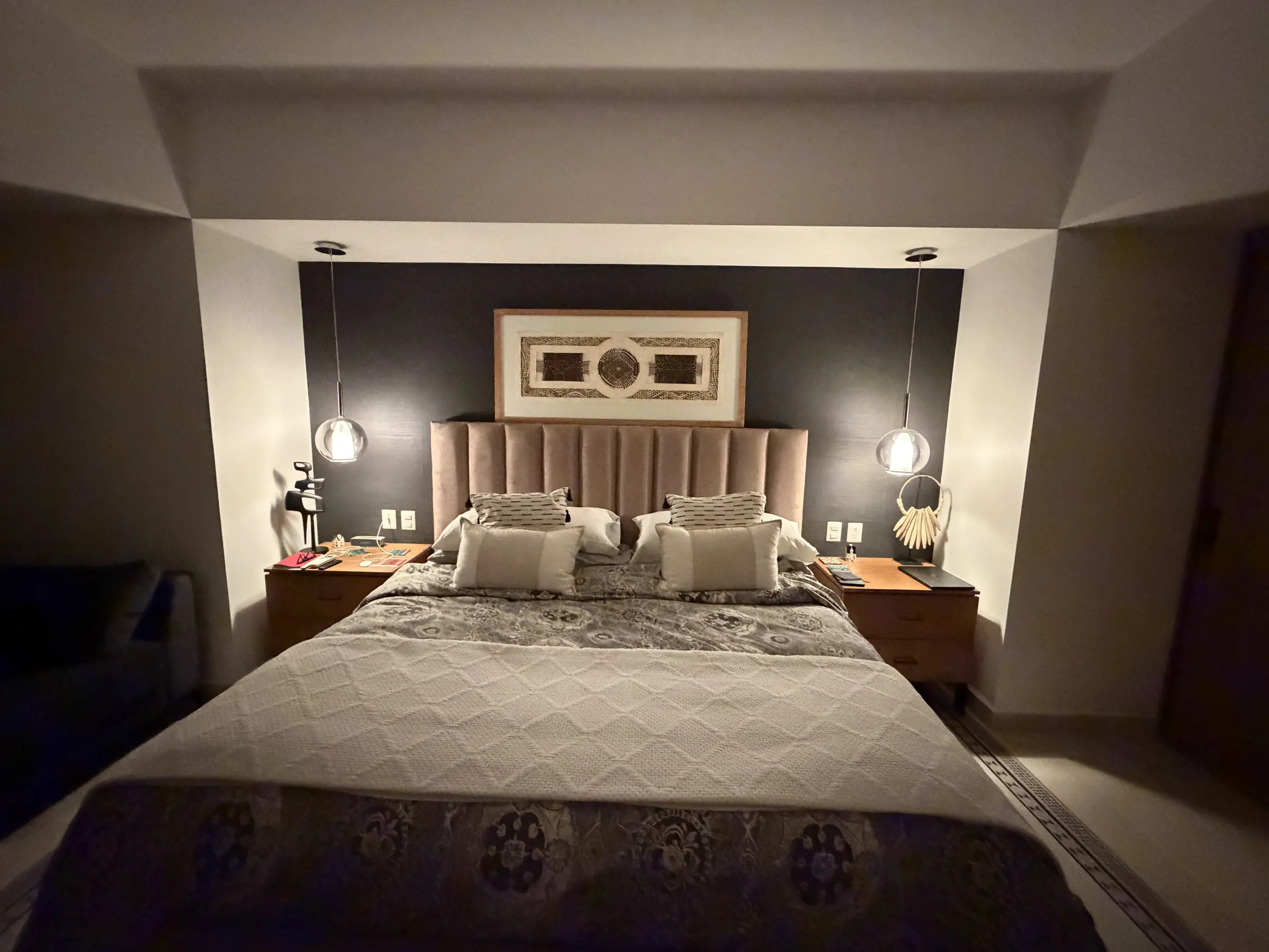 King bedroom with warm evening lighting